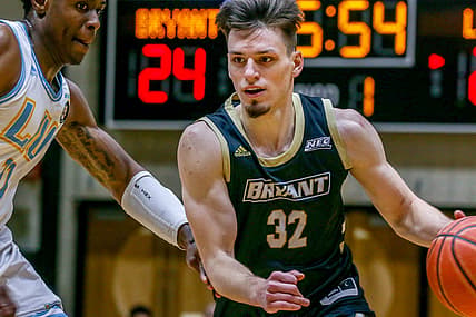 Bryant's Peter Kiss gets past Long Island's Eral Penn.

Bryant Basketball