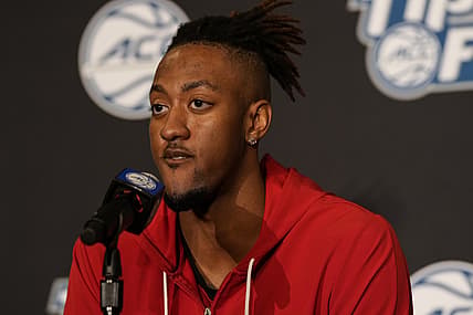 Oct 12, 2021; Charlotte, NC, USA; North Carolina State Wolfpack forward Manny Bates (15) speaks to the media at the ACC Tip Off at Charlotte Marriott City Center. Mandatory Credit: Jim Dedmon-USA TODAY Sports