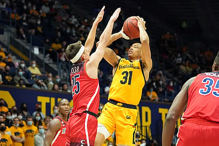 Jan 23, 2022; Berkeley, California, USA; California Golden Bears guard Jordan Shepherd (31) scores over Arizona Wildcats guard Kerr Kriisa (25) during the second half at Haas Pavilion. Mandatory Credit: Darren Yamashita-USA TODAY Sports