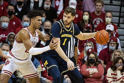 Jan 23, 2022; Bloomington, Indiana, USA; Michigan Wolverines center Hunter Dickinson (1) dribbles the ball while Indiana Hoosiers forward Trayce Jackson-Davis (23) defends  in the first half at Simon Skjodt Assembly Hall. Mandatory Credit: Trevor Ruszkowski-USA TODAY Sports