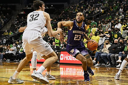 Jan 23, 2022; Eugene, Oregon, USA; Washington Huskies guard Terrell Brown Jr. (23) drives to the basket during the second half against Oregon Ducks center Nate Bittle (32) at Matthew Knight Arena. The Ducks won the game 84-56. Mandatory Credit: Troy Wayrynen-USA TODAY Sports