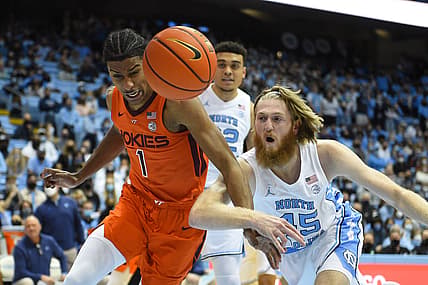 Jan 26, 2022; Chapel Hill, North Carolina, USA;  Virginia Tech Hokies forward David N'Guessan (1) and North Carolina Tar Heels forward Brady Manek (45) fight for the ball in the first half at Dean E. Smith Center. Mandatory Credit: Bob Donnan-USA TODAY Sports