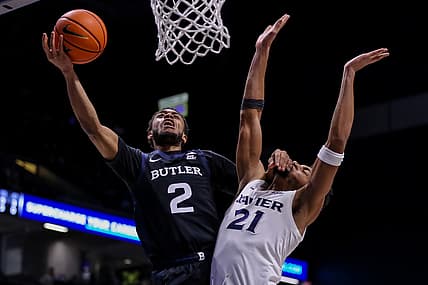 Feb 2, 2022; Cincinnati, Ohio, USA; Butler Bulldogs guard Aaron Thompson (2) goes up for a shot against Xavier Musketeers forward Jerome Hunter (21) in the first half at Cintas Center. Mandatory Credit: Katie Stratman-USA TODAY Sports