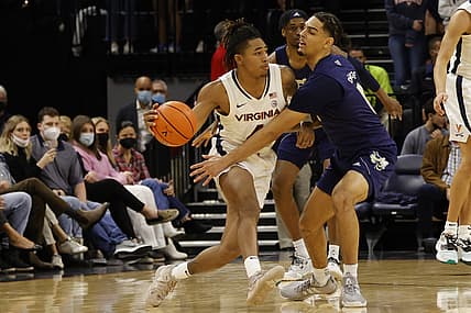 Feb 12, 2022; Charlottesville, Virginia, USA; Virginia Cavaliers guard Armaan Franklin (4) dribbles the ball as Georgia Tech Yellow Jackets guard Michael Devoe (0) defends during the first half at John Paul Jones Arena. Mandatory Credit: Geoff Burke-USA TODAY Sports