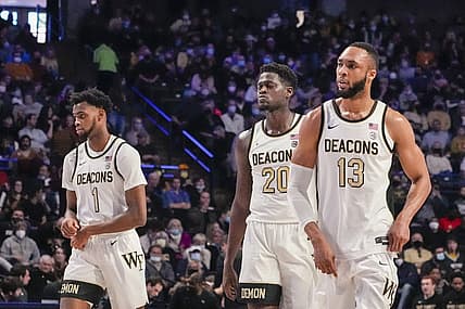 Feb 19, 2022; Winston-Salem, North Carolina, USA; Wake Forest Demon Deacons forward Isaiah Mucius (1),  forward Khadim Sy (20), and forward Dallas Walton (13) during the second half against the Notre Dame Fighting Irish at Lawrence Joel Veterans Memorial Coliseum. Mandatory Credit: Jim Dedmon-USA TODAY Sports