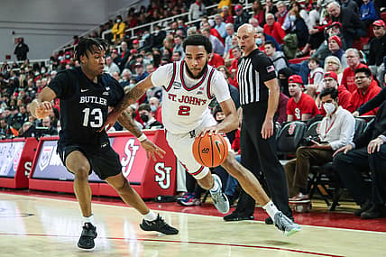 Feb 18, 2022; Queens, New York, USA;  St. John's Red Storm forward Julian Champagnie (2) and Butler Bulldogs guard Jayden Taylor (13) at Carnesecca Arena. Mandatory Credit: Wendell Cruz-USA TODAY Sports