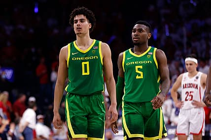 Feb 19, 2022; Tucson, Arizona, USA; Oregon Ducks guard Will Richardson (0) talks with guard De'Vion Harmon (5) during the second half against the Arizona Wildcats at McKale Center. The Wildcats beat the Ducks 84-81. Mandatory Credit: Chris Coduto-USA TODAY Sports