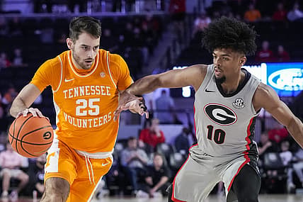 Mar 1, 2022; Athens, Georgia, USA; Tennessee Volunteers guard Santiago Vescovi (25) dribbles against Georgia Bulldogs guard Aaron Cook (10) during the first half at Stegeman Coliseum. Mandatory Credit: Dale Zanine-USA TODAY Sports