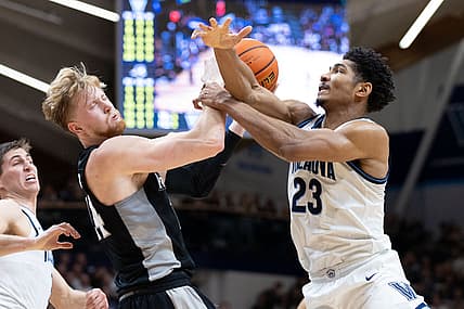 Mar 1, 2022; Villanova, Pennsylvania, USA; Villanova Wildcats forward Jermaine Samuels (23) and Providence Friars forward Noah Horchler (14) battle for a loose ball during the first half at William B. Finneran Pavilion. Mandatory Credit: Bill Streicher-USA TODAY Sports