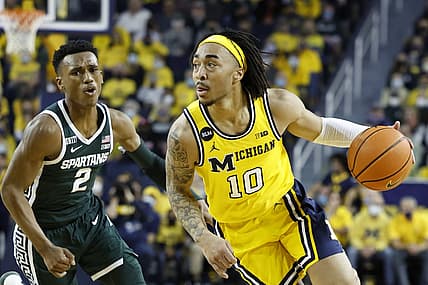 Mar 1, 2022; Ann Arbor, Michigan, USA;  Michigan Wolverines guard Frankie Collins (10) dribbles on Michigan State Spartans guard Tyson Walker (2) in the first half at Crisler Center. Mandatory Credit: Rick Osentoski-USA TODAY Sports