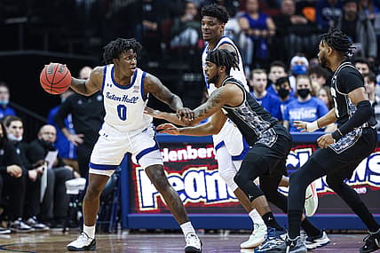 Mar 2, 2022; Newark, New Jersey, USA; Seton Hall Pirates guard Kadary Richmond (0) dribbles as Georgetown Hoyas guard Kaiden Rice (11) defends during the first half at Prudential Center. Mandatory Credit: Vincent Carchietta-USA TODAY Sports