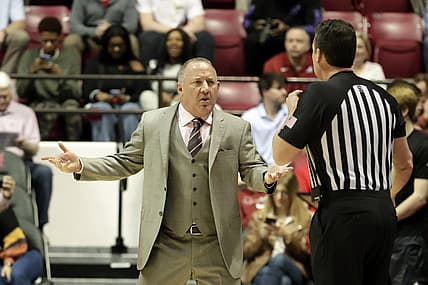 Mar 2, 2022; Tuscaloosa, Alabama, USA; Texas A&M Aggies head coach Buzz Williams (left) reacts to a call during the first half against the Alabama Crimson Tide at Coleman Coliseum. Mandatory Credit: Butch Dill-USA TODAY Sports