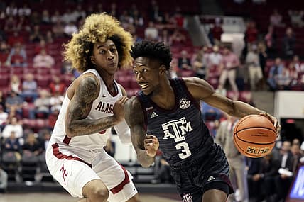 Mar 2, 2022; Tuscaloosa, Alabama, USA; Texas A&M Aggies guard Quenton Jackson (3) dribbles around Alabama Crimson Tide guard JD Davison (3) during the first half at Coleman Coliseum. Mandatory Credit: Butch Dill-USA TODAY Sports