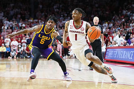 Mar 2, 2022; Fayetteville, Arkansas, USA; Arkansas Razorbacks guard JD Notae (1) dives against LSU Tigers forward Mwani Wilkinson (5) during the second half at Bud Walton Arena. Arkansas won 77-76. Mandatory Credit: Nelson Chenault-USA TODAY Sports