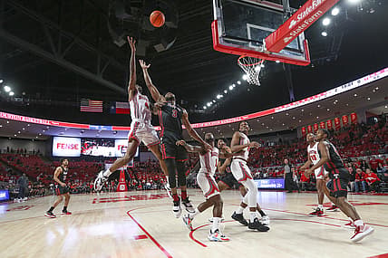 Mar 3, 2022; Houston, Texas, USA; Houston Cougars guard Taze Moore (4) and Temple Owls forward Sage Tolbert III (3) reach for a rebound in the first half at Fertitta Center. Mandatory Credit: Thomas Shea-USA TODAY Sports