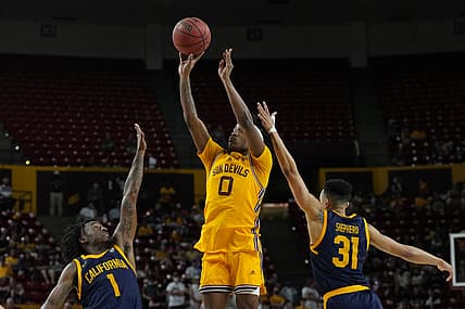 Mar 3, 2022; Tempe, Arizona, USA; Arizona State Sun Devils guard DJ Horne (0) shoots over California Golden Bears guard Joel Brown (1) and California Golden Bears guard Jordan Shepherd (31) during the second half at Desert Financial Arena. Mandatory Credit: Joe Camporeale-USA TODAY Sports