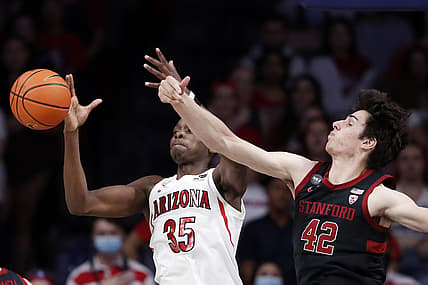 Mar 3, 2022; Tucson, Arizona, USA; Stanford Cardinal forward Maxime Raynaud (42) knocks the ball away from Arizona Wildcats center Christian Koloko (35) during the first half at McKale Center. Mandatory Credit: Chris Coduto-USA TODAY Sports