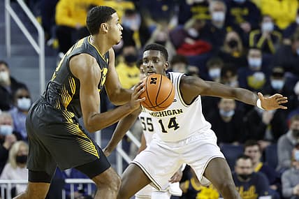 Mar 3, 2022; Ann Arbor, Michigan, USA; Iowa Hawkeyes forward Keegan Murray (15) controls the ball against Michigan Wolverines forward Moussa Diabate (14) in the first half t Crisler Center. Mandatory Credit: Rick Osentoski-USA TODAY Sports