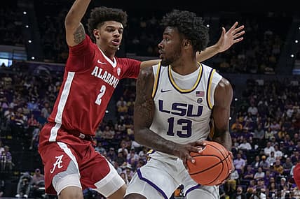 Mar 5, 2022; Baton Rouge, Louisiana, USA;  LSU Tigers forward Tari Eason (13) dribbles against Alabama Crimson Tide forward Darius Miles (2) during the first half at the Pete Maravich Assembly Center. Mandatory Credit: Stephen Lew-USA TODAY Sports