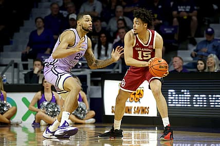 Mar 5, 2022; Manhattan, Kansas, USA; Oklahoma Sooners forward Ethan Chargois (15) is guarded by Kansas State Wildcats forward Davion Bradford (21) during the first half at Bramlage Coliseum. Mandatory Credit: Scott Sewell-USA TODAY Sports