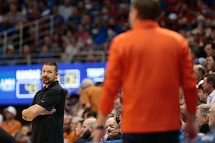 Texas coach Chris Beard looks over the Kansas coach Bill Self after tying the game during the second half of Saturday's game inside Allen Fieldhouse.