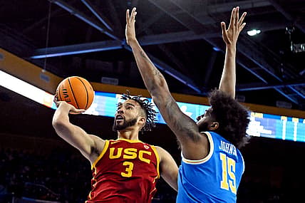 Mar 5, 2022; Los Angeles, California, USA; USC Trojans forward Isaiah Mobley (3) shoots the ball against UCLA Bruins center Myles Johnson (15) during the first half at Pauley Pavilion presented by Wescom. Mandatory Credit: Richard Mackson-USA TODAY Sports