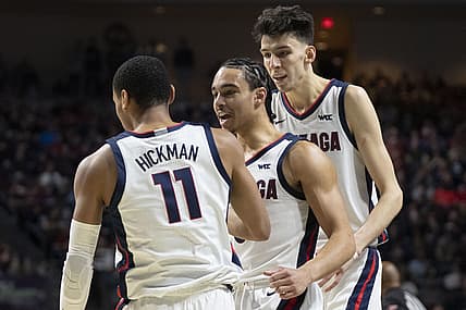 March 7, 2022; Las Vegas, NV, USA; Gonzaga Bulldogs guard Andrew Nembhard (3) and center Chet Holmgren (34) congratulate guard Nolan Hickman (11) against the San Francisco Dons during the first half in the semifinals of the WCC Basketball Championships at Orleans Arena. Mandatory Credit: Kyle Terada-USA TODAY Sports