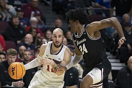 March 7, 2022; Las Vegas, NV, USA; Saint Mary's Gaels guard Tommy Kuhse (12) dribbles the basketball against Santa Clara Broncos guard Jalen Williams (24) during the first half in the semifinals of the WCC Basketball Championships at Orleans Arena. Mandatory Credit: Kyle Terada-USA TODAY Sports