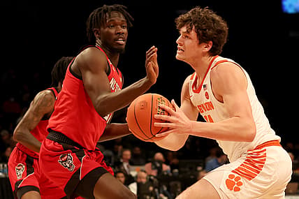Mar 8, 2022; Brooklyn, NY, USA; Clemson Tigers forward PJ Hall (24) drives to the basket against North Carolina State Wolfpack forward Ebenezer Dowuona (21) during the first half at Barclays Center. Mandatory Credit: Brad Penner-USA TODAY Sports