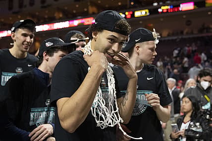 March 8, 2022; Las Vegas, NV, USA; Gonzaga Bulldogs forward Anton Watson (22) puts the net around his neck after defeating the Saint Mary's Gaels after the game in the finals of the WCC Basketball Championships at Orleans Arena. Mandatory Credit: Kyle Terada-USA TODAY Sports