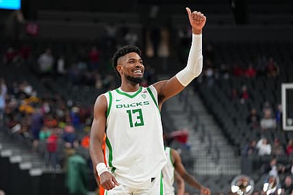 Mar 9, 2022; Las Vegas, Nevada, USA; Oregon Ducks forward Quincy Guerrier (13) celebrates after the Ducks defeated the Oregon State Beavers 86-72 at T-Mobile Arena. Mandatory Credit: Stephen R. Sylvanie-USA TODAY Sports