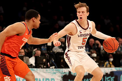 Mar 9, 2022; Brooklyn, NY, USA; Virginia Tech Hokies guard Storm Murphy (5) controls the ball against Clemson Tigers guard Nick Honor (4) during the first half at Barclays Center. Mandatory Credit: Brad Penner-USA TODAY Sports