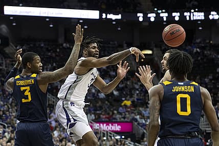 Mar 9, 2022; Kansas City, MO, USA; Kansas State Wildcats guard Selton Miguel (3) passes while defended by West Virginia Mountaineers forward Gabe Osabuohien (3) in the first half at T-Mobile Center. Mandatory Credit: Amy Kontras-USA TODAY Sports