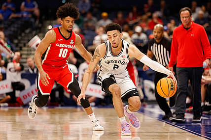 Mar 9, 2022; Tampa, FL, USA;  Vanderbilt Commodores guard Scotty Pippen Jr. (2) controls the ball from Georgia Bulldogs guard Aaron Cook (10) in the first half at Amelie Arena. Mandatory Credit: Nathan Ray Seebeck-USA TODAY Sports