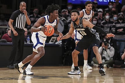 Mar 9, 2022; New York, NY, USA;  Seton Hall Pirates guard Kadary Richmond (0) looks to drive past Georgetown Hoyas guard Donald Carey (13) in the first half at the Big East Conference Tournament at Madison Square Garden. Mandatory Credit: Wendell Cruz-USA TODAY Sports