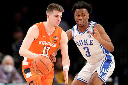 Mar 10, 2022; Brooklyn, NY, USA; Syracuse Orange guard Joseph Girard III (11) controls the ball against Duke Blue Devils guard Jeremy Roach (3) during the first half at Barclays Center. Mandatory Credit: Brad Penner-USA TODAY Sports