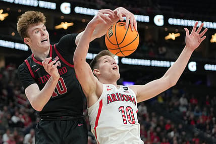 Mar 10, 2022; Las Vegas, NV, USA; Stanford Cardinal forward Max Murrell (10) attempts to steal the ball from Arizona Wildcats forward Azuolas Tubelis (10) during the first half at T-Mobile Arena. Mandatory Credit: Stephen R. Sylvanie-USA TODAY Sports