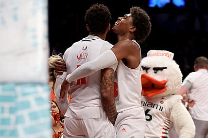 Mar 10, 2022; Brooklyn, NY, USA; Miami Hurricanes guard Jordan Miller (11) celebrates his buzzer beater layup with guard Charlie Moore (3) to beat the Boston College Eagles during overtime at Barclays Center. Mandatory Credit: Brad Penner-USA TODAY Sports