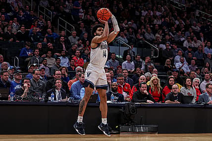 Mar 10, 2022; New York, NY, USA; Villanova Wildcats guard Caleb Daniels (14) makes a three point basket against the St. John's Red Storm during the second half at Madison Square Garden. Mandatory Credit: Vincent Carchietta-USA TODAY Sports