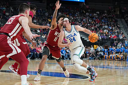 Mar 10, 2022; Las Vegas, NV, USA; UCLA Bruins guard Jaime Jaquez Jr. (24) dribbles against Washington State Cougars forward DJ Rodman (11) during the first half at T-Mobile Arena. Mandatory Credit: Stephen R. Sylvanie-USA TODAY Sports