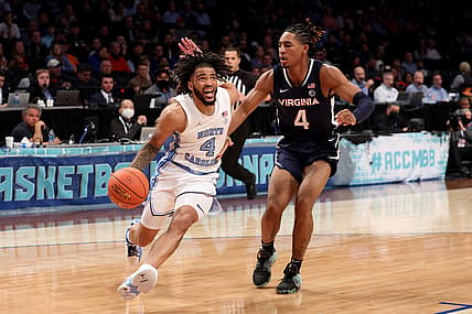 Mar 10, 2022; Brooklyn, NY, USA; North Carolina Tar Heels guard R.J. Davis (4) drives to the basket against Virginia Cavaliers guard Armaan Franklin (4) during the first half at Barclays Center. Mandatory Credit: Brad Penner-USA TODAY Sports