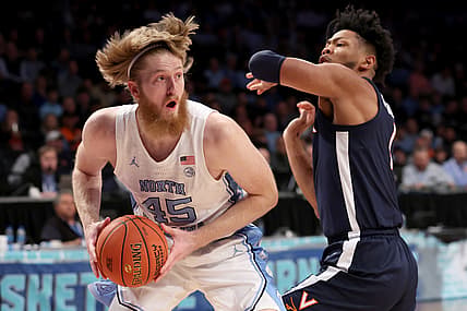 Mar 10, 2022; Brooklyn, NY, USA; North Carolina Tar Heels forward Brady Manek (45) controls the ball against Virginia Cavaliers forward Jayden Gardner (1) during the first half at Barclays Center. Mandatory Credit: Brad Penner-USA TODAY Sports
