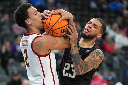Mar 10, 2022; Las Vegas, NV, USA; USC Trojans forward Kobe Johnson (2) and Washington Huskies guard Terrell Brown Jr. (23) vie for control of the ball after the whistle during the first half at T-Mobile Arena. Mandatory Credit: Stephen R. Sylvanie-USA TODAY Sports
