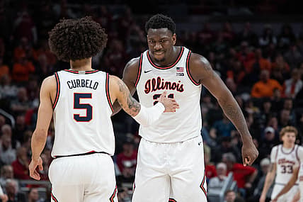 Mar 11, 2022; Indianapolis, IN, USA;  Illinois Fighting Illini center Kofi Cockburn (21) and Illinois Fighting Illini guard Andre Curbelo (5) celebrate in the second half Indiana Hoosiers at Gainbridge Fieldhouse. Mandatory Credit: Trevor Ruszkowski-USA TODAY Sports