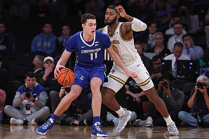 Mar 11, 2022; New York, NY, USA; Creighton Bluejays center Ryan Kalkbrenner (11) dribbles as Providence Friars center Nate Watson (0) defends during the first half at Madison Square Garden. Mandatory Credit: Vincent Carchietta-USA TODAY Sports