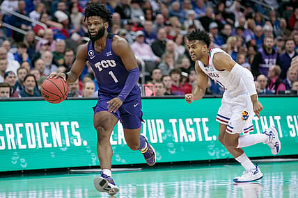 Mar 11, 2022; Kansas City, MO, USA; TCU Horned Frogs guard Mike Miles (1) brings the ball up court past Kansas Jayhawks guard Remy Martin (11) during the first half at T-Mobile Center. Mandatory Credit: William Purnell-USA TODAY Sports