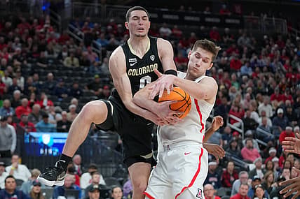 Mar 11, 2022; Las Vegas, NV, USA; Arizona Wildcats forward Azuolas Tubelis (10) pulls a rebound away from Colorado Buffaloes guard Luke O'Brien (0) during the first half at T-Mobile Arena. Mandatory Credit: Stephen R. Sylvanie-USA TODAY Sports