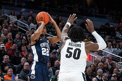 Mar 11, 2022; Indianapolis, IN, USA; Penn State Nittany Lions guard Jalen Pickett (22) shoots the ball while Purdue Boilermakers forward Trevion Williams (50) defends in the first half at Gainbridge Fieldhouse. Mandatory Credit: Trevor Ruszkowski-USA TODAY Sports