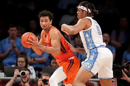 Mar 11, 2022; Brooklyn, NY, USA; Virginia Tech Hokies forward Keve Aluma (22) controls the ball against North Carolina Tar Heels forward Armando Bacot (5) during the first half of the ACC Tournament semifinal game at Barclays Center. Mandatory Credit: Brad Penner-USA TODAY Sports
