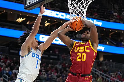 Mar 11, 2022; Las Vegas, NV, USA; USC Trojans guard Ethan Anderson (20) shoots against UCLA Bruins guard Jules Bernard (1) during the first half at T-Mobile Arena. Mandatory Credit: Stephen R. Sylvanie-USA TODAY Sports